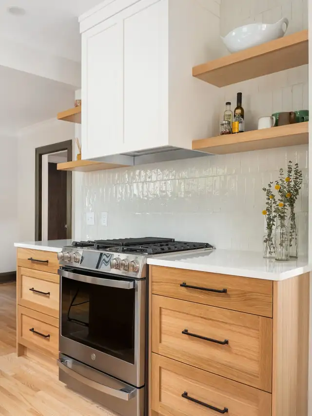 Hale Tudor family kitchen with white shaker uppers, maple lower cabinets, floating shelves and glossy white tile